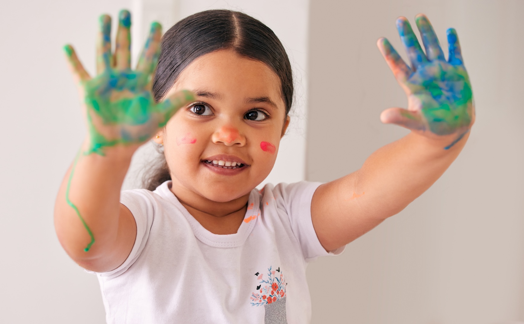 Girl with painted hands